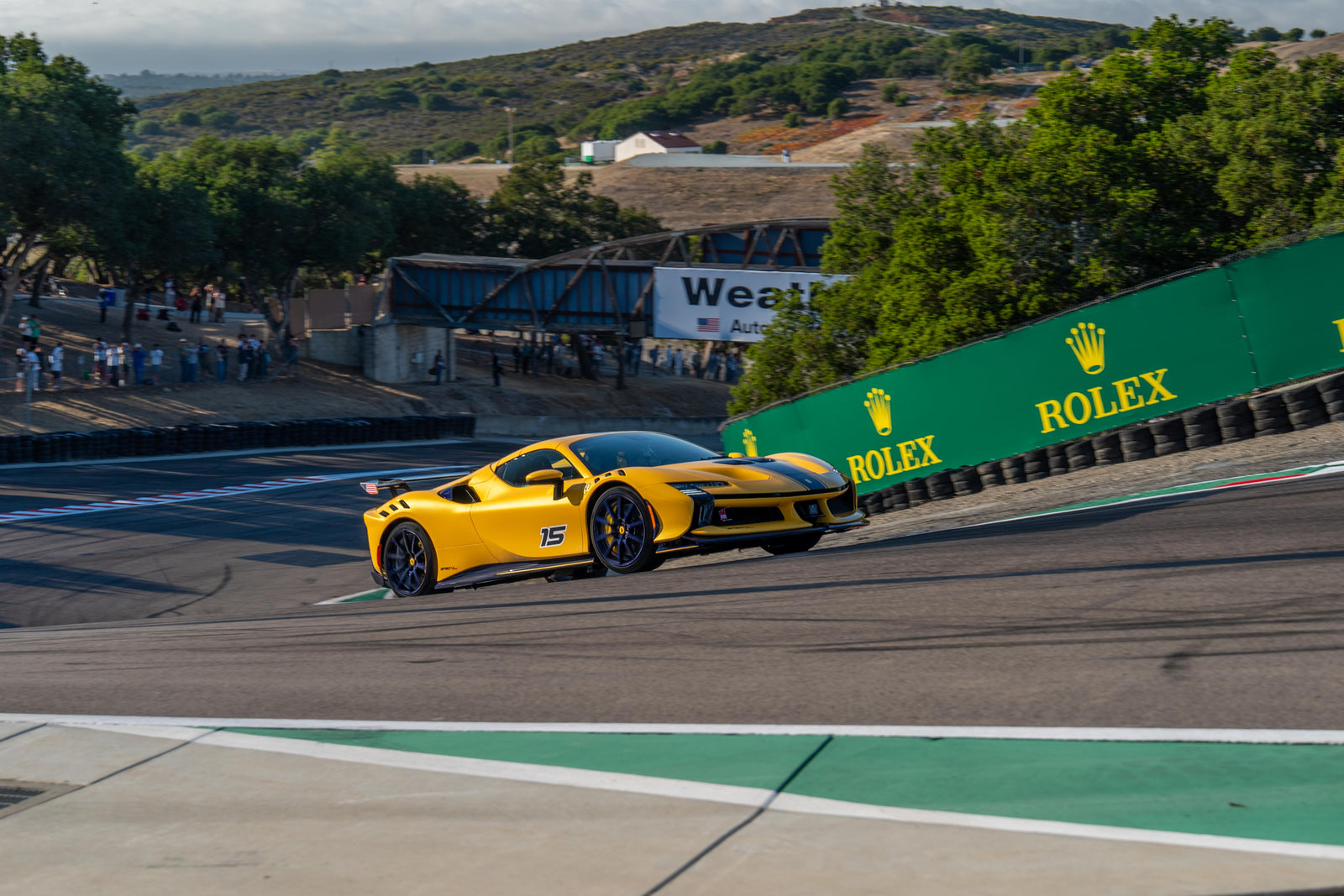 Historic race car climbing toward the Corkscrew at WeatherTech Raceway Laguna Seca
