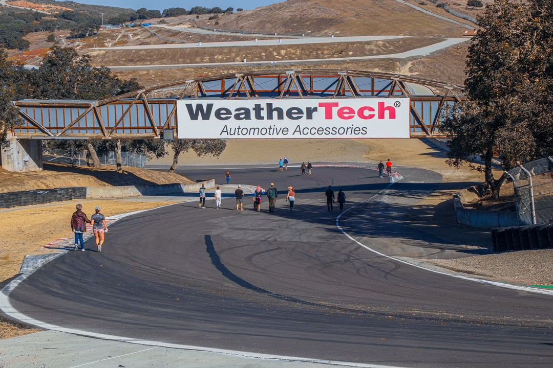 Turkey Trot participants walking through the Corkscrew at Laguna Seca