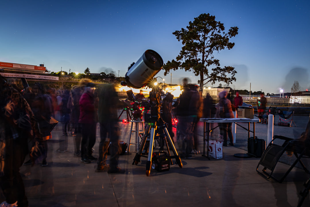 Telescopes set up beneath the evening sky at Laguna Seca