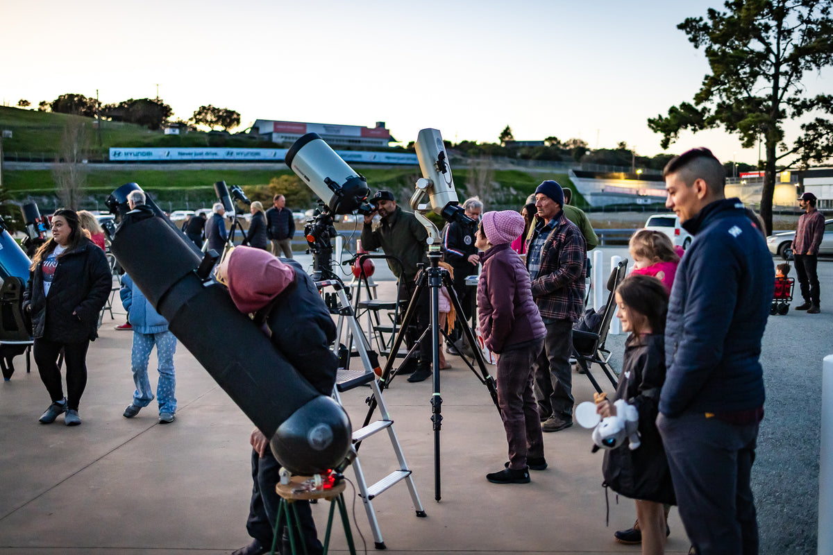 Guests using telescopes during Race to Space at WeatherTech Raceway Laguna Seca